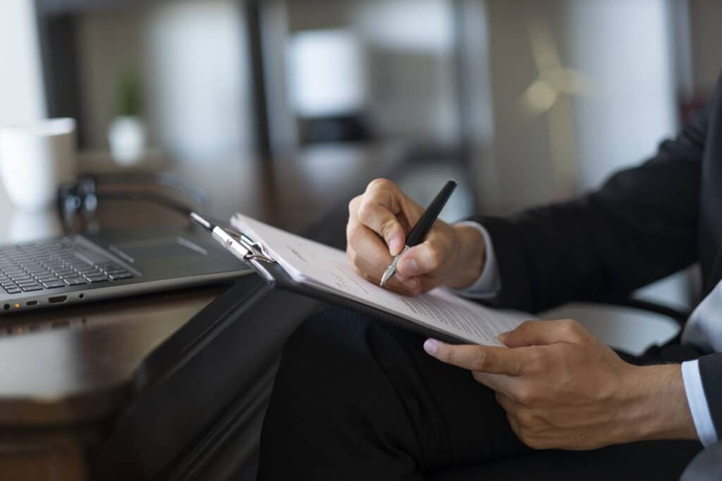 unknown businessman prepares official document